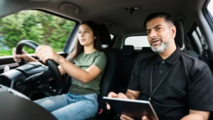 Learner driver reviewing driving test results and planning next attempt with instructor
