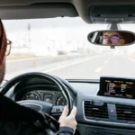 A skilled driver driving during the day and following fundamental driving rules—skills every new driver must master.